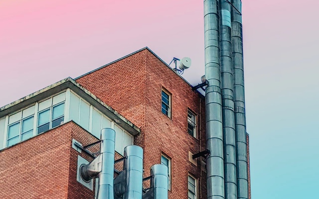 brown building with chimneys